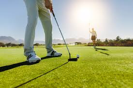Professional following a golf plan on the course